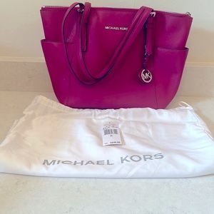 Michael kors leather tote. Deep pink. Gently used with tag and dust bag.